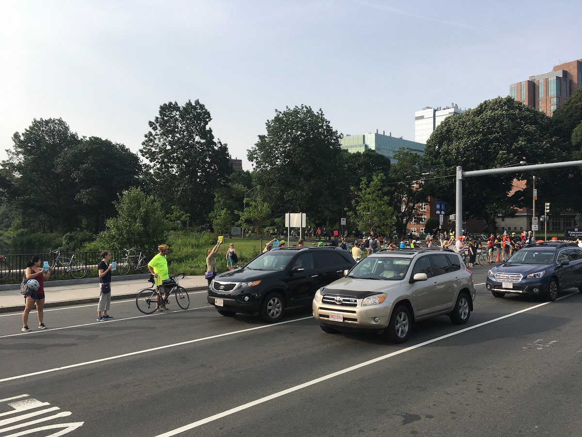Safety advocates line Brookline Avenue (foreground) and Fenway (behind) on the morning of July 11, 2019.