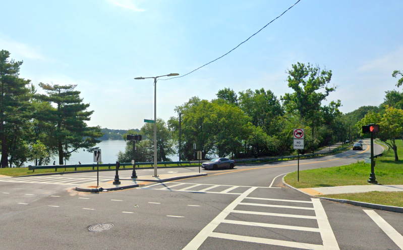 A Google Street View image of Francis Parkman Drive at its intersection with Perkins Street on the north shore of Jamaica Pond in Boston.