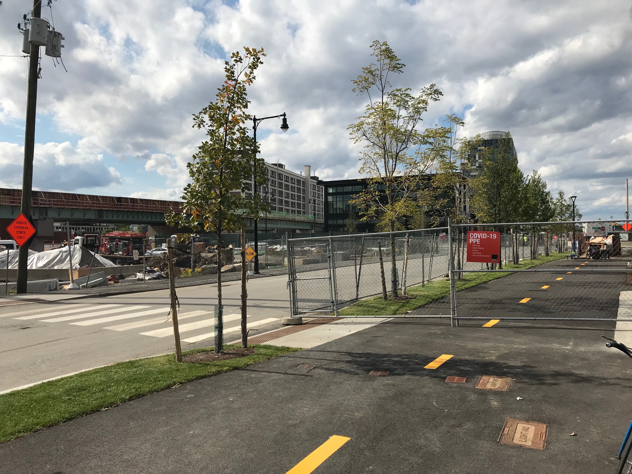 In the new Cambridge Crossing development, just north of the Lechmere viaduct, developers have already built a 300-meter section of the Community Path between North Point Park and First Street, next to the future Lechmere station. This photo shows the new path looking northwest, towards the yet-to-open viaduct.