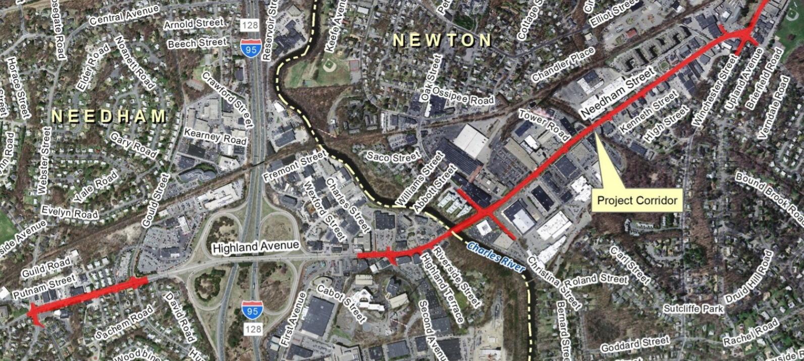 A satellite map of the Newton-Needham border highlighting (in red) Needham Street in Newton, which runs from the center of the map to the upper-right corner, and a separate segment of Highland Avenue in Needham, in the lower left. The Charles River curves through the center of the map from the upper to lower edge.