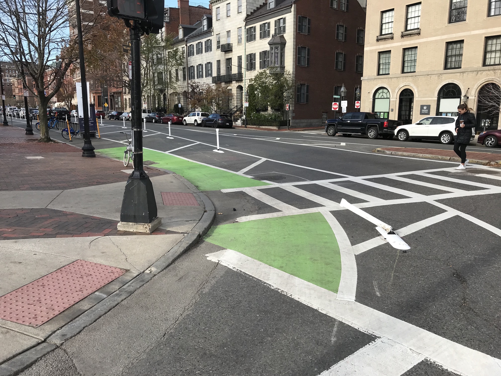 As seen in this photo, taken on November 17, A driver had already run over one of the project's new flexposts at the corner of Charles and Beacon St., at the northeast corner of the Public Garden, just days after installation.