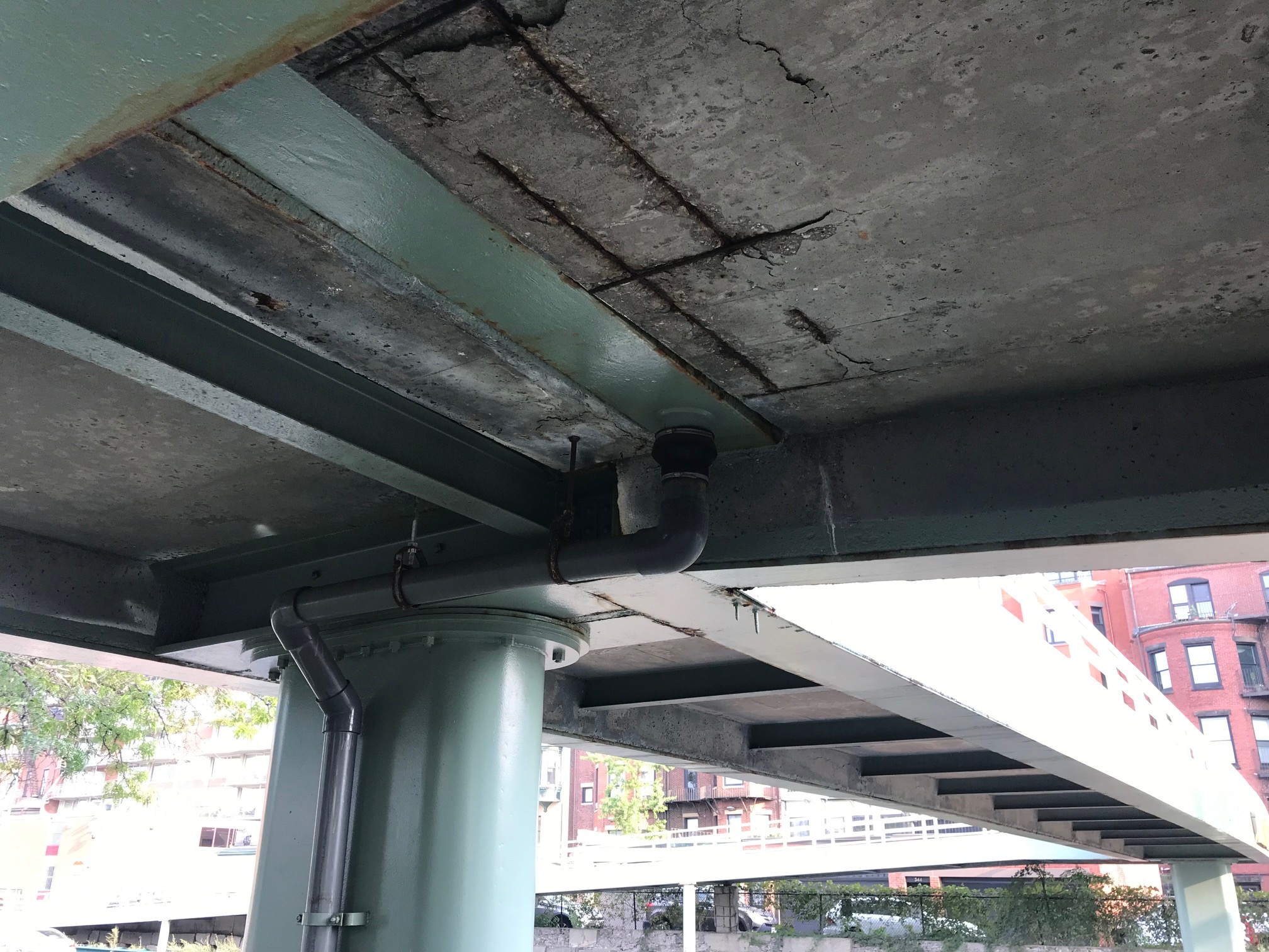 Underside of Fairfield St. overpass over Storrow Drive, showing concrete spalling. 