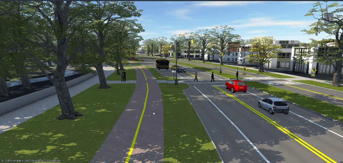 Looking northbound, this 3-D representation shows the proposed design for the crosswalk area just south of the arboretum driveway near the Hunnewell Visitor Center. The separated facility between the green spaces is expected to be between 12-14 feet wide and be used as either a shared use path or a separated bike lane. Currently, this is a three lane road with an unprotected painted bike lane in the southbound direction.
