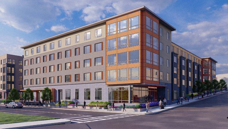 A rendering of a 5-story apartment building on a hillside. The building is clad primarily in grey with a brick-red accent on the corners. 